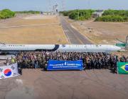 Innospace team members with brazilian air force and space agency officials in front of the hanbit nano