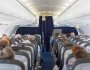 passengers sitting in the cabin of an airplane