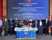 officials at contract signing ceremony