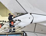 Daher employee and an aircraft