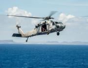  MH-60R Seahawk helicopter from the Saberhawks of Helicopter Maritime Strike Squadron (HSM) 77 prepares to land on the aircraft carrier USS George Washington (CVN 73) after delivering fresh water to the Republic of the Philippines in support of Operatio Contributor: MixPix