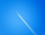 jet airliner with contrail