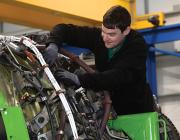 aircraft technician working on engine