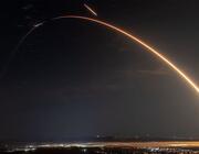 A long exposure shot of SpaceX launching the National Reconnaissance Office’s NROL-105 mission on a Falcon 9 rocket on Jan. 16. 2026, from Vandenberg SFB, California, and the return of the booster following stage separation. Credit: SpaceX
