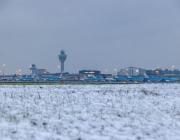 Amsterdam Schiphol Airport in the winter of 2025 with snow on the ground