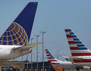 tails of United Airlines and American Airlines aircraft at airport