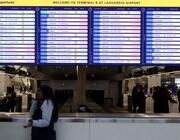 LaGuardia Airport flight information board shows flights canceled on Feb. 22, 2026