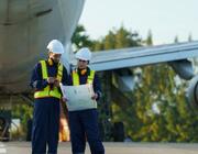 mechanics in front of an airplane