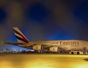 After its return flight to Dubai International Airport (DXB) was canceled due to the war in the Middle East, an Emirates airplane remains parked at Los Angeles International Airport (LAX) on March 2, 2026.