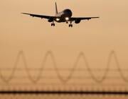 plane landing at sunset