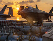 Lockheed Martin F-35s and missiles by the sea