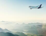 Lufthansa aircraft inflight over mountains