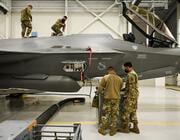 four air force maintainers working on F-35