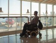 Motorized wheelchair user at airport
