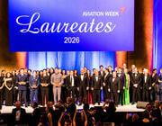 Laureates group standing on stage
