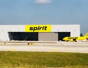 Spirit Airlines aircraft in front of hangar