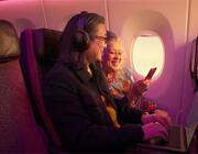 A couple using starlink for their devices inflight