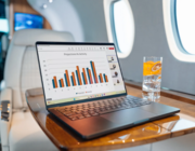 laptop and drink on a bizjet table