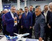 Tupolev Deputy Chief Designer Kirill Aseev (left) shows the Tu-454 model to the head of Russia’s Tatarstan region.