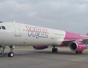 A Wizz Air Airbus A321ceo on the runway.