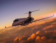 Business jet flying above clouds in the sunset