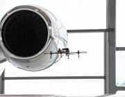 an engine with a drone flying next to it