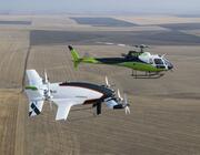 Art credit: Airbus Caption: Acubed's autonomous Vahana (foreground) demonstrated full transition between vertical and wingborne flight in 2019