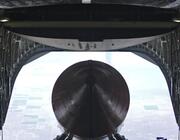 AirLaunch Drop Test Article exits a C-17 at 32,000 feet, during a late-July test. (Air Force photo by Jim Shryne)