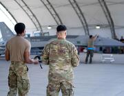 Airmen looking into a hangar