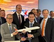 Philippine Airlines and Airbus officials unveil the A350-1000 commitment at the Farnborough Airshow.