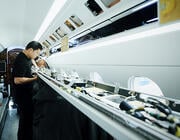 person fitting out aircraft cabin