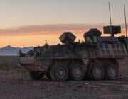 armored military vehicle in desert landscape