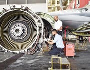 MAB Engineering Services aircraft maintenance engineers performing inspection and servicing work on a turbofan