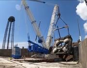 The 2 million-lb. launch table at SLC-36 was lifted out of flame trench in July for inspections and adjustments. 