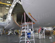 aircraft in hangar undergoing repair