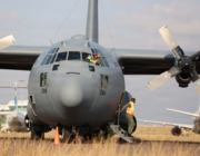 man waving from Lockheed C-130H in Botswana