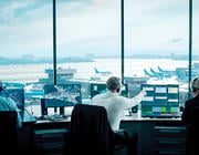 three air traffic controllers in tower