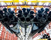 A SpaceX Falcon Heavy and its 27 Merlin engines are positioned in a hangar at Launch Complex 39A at the Kennedy Space Center in Florida, preparing to support the first National Reconnaissance Office mission using that launch vehicle. Credit: SpaceX