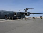 A U.S. Air Force C-17 and airmen arrive in the Middle East for a deployment in January.