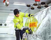 dhl worker securing shipment