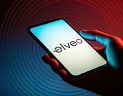 hand holding phone displaying elveo logo on screen