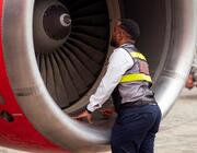 Man looking into jet intake