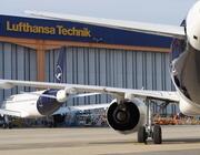 commercial lufthansa aircraft parked outside lufthansa technik hangar