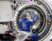 rolls-royce technician assembling a jet engine