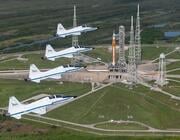 nasa t-38s fly over space launch system