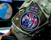 close-up of military camouflage uniform bearing uk space command patch