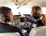 pilot trainee and flight instructor in cockpit