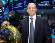 Russell Ford posing by the NYSE bell