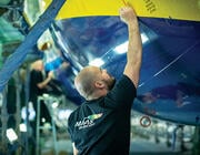 MAAS Aviation employee working on aircraft