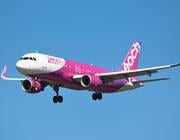 peach airbus a320-200 in flight
